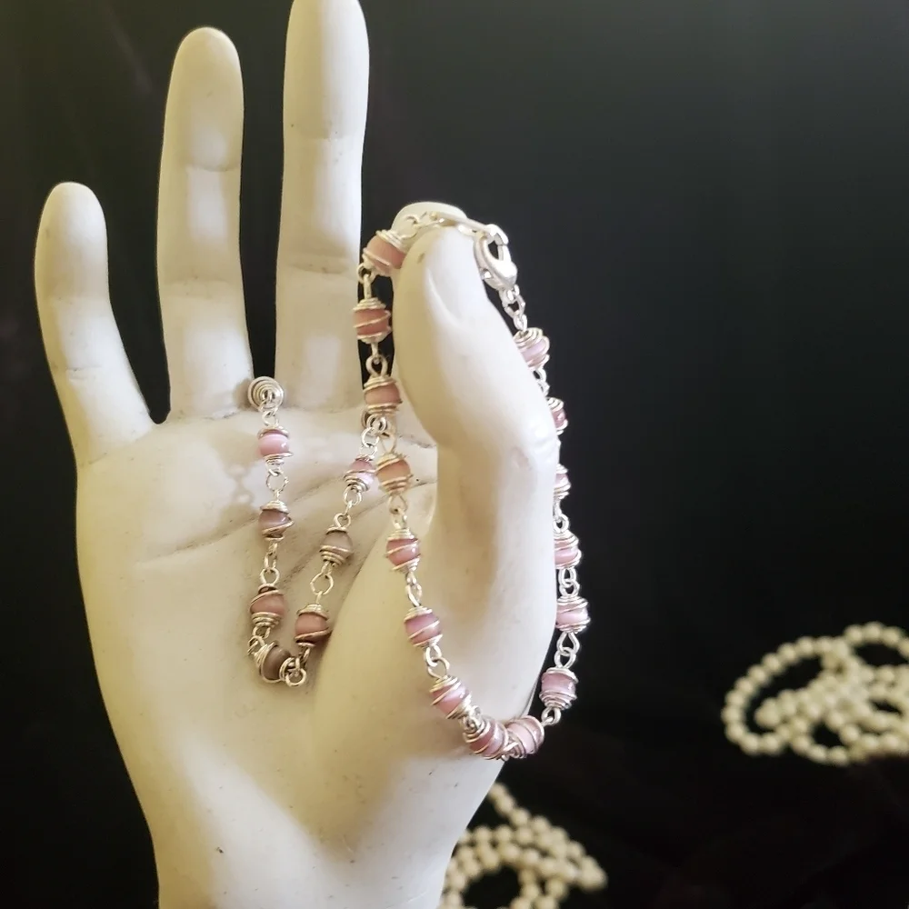 Two silver with pink pearl stones